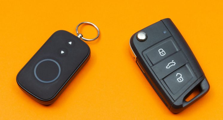 car-key-with-remote-alarm-control-on-the-orange-ba-2021-09-03-02-17-04-utc (1)